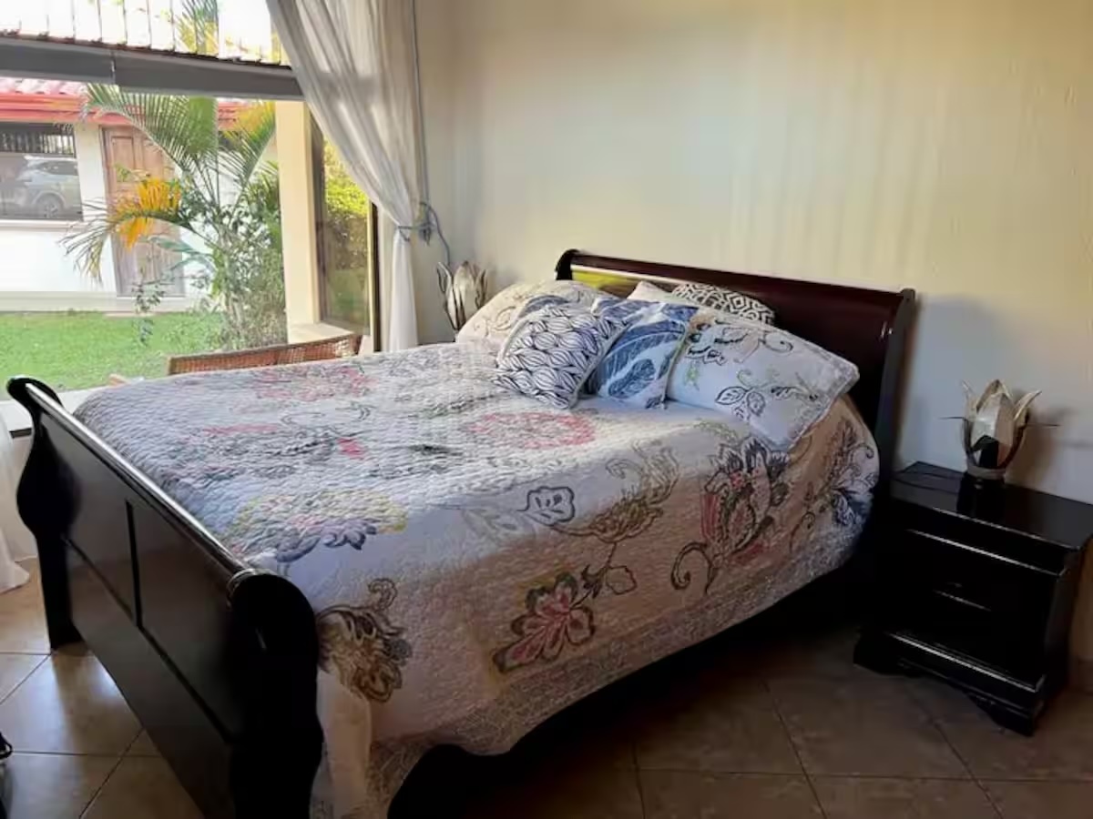 A queen bedroom in the main house